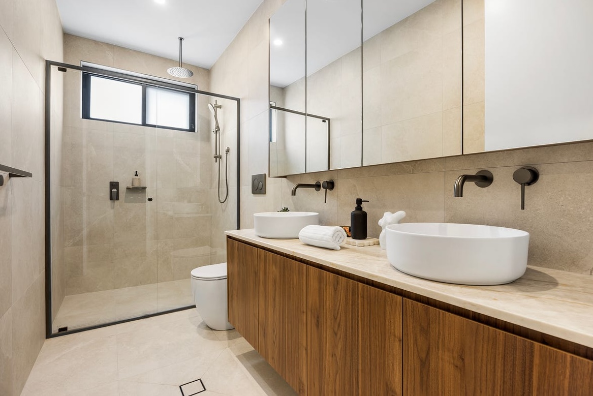 Completed Five Star Bathrooms renovation with a timber double vanity and walk-in shower