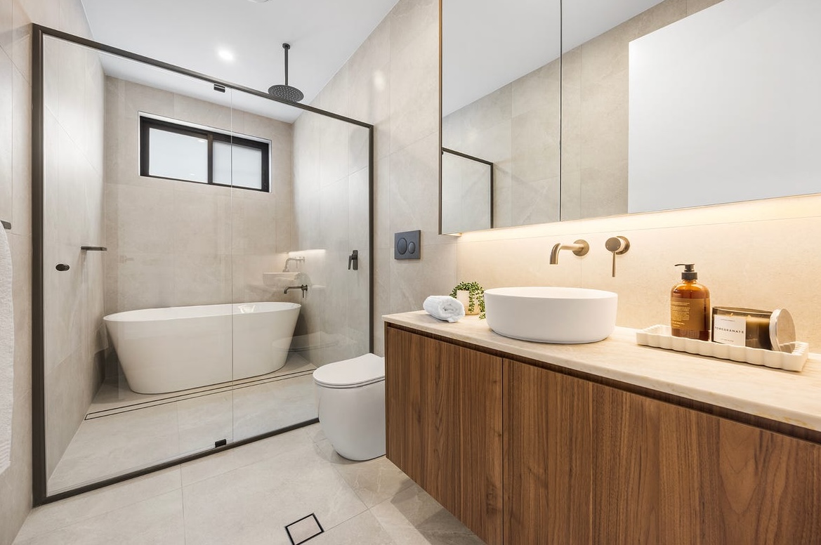 Luxury bathroom renovation package example with a tiled feature wall