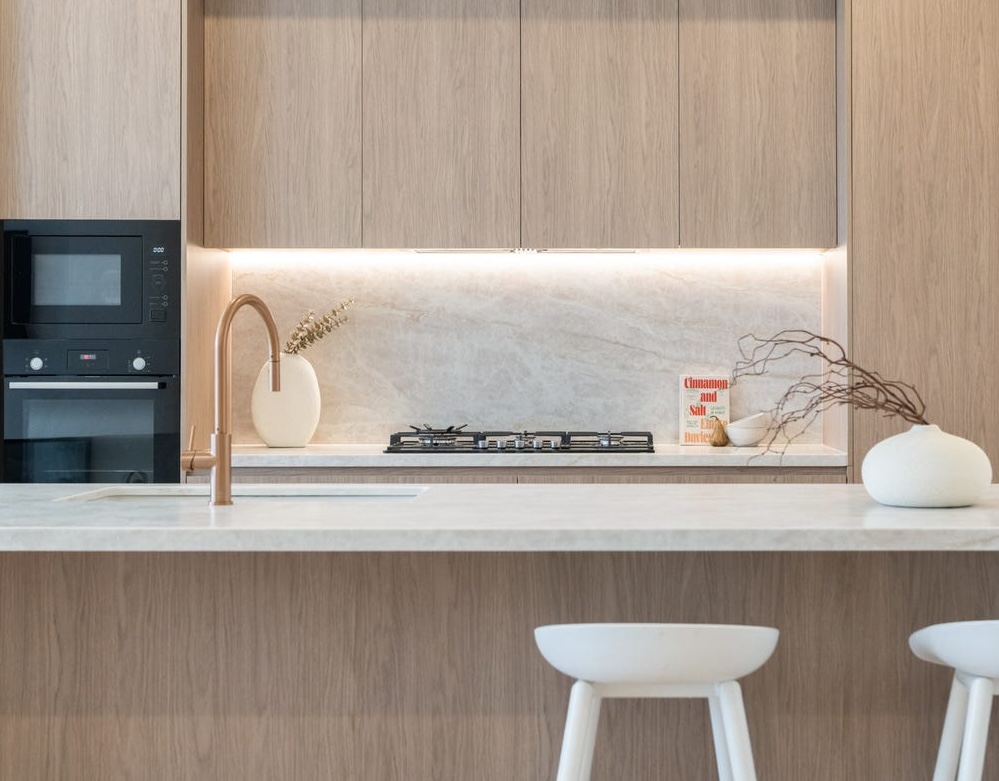 Kitchen sink, brushed gold tapware and hardware in a Sydney renovation
