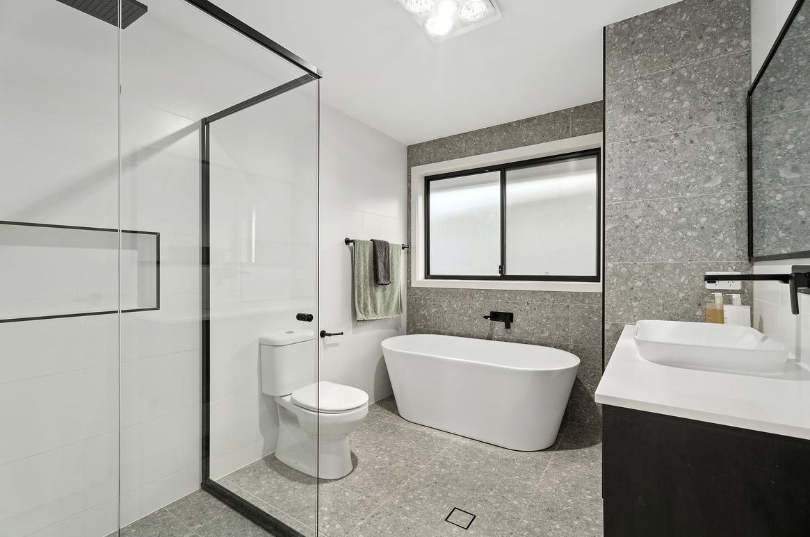 Deluxe bathroom renovation package example with a freestanding bath