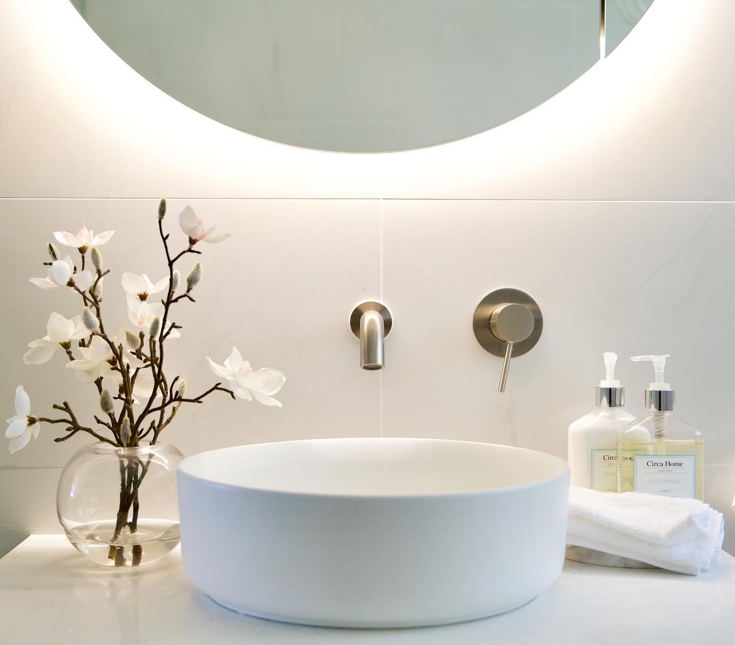 Modern bathroom renovation with warm lighting